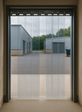 Made to Measure PVC Strip Curtains hanging in an industrial doorway, ideal for temperature control and hygiene.